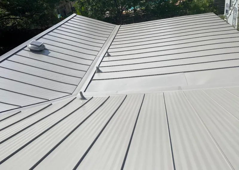 Solar attic fan installed on a metal roof for Roof Ventilation in South Sioux City